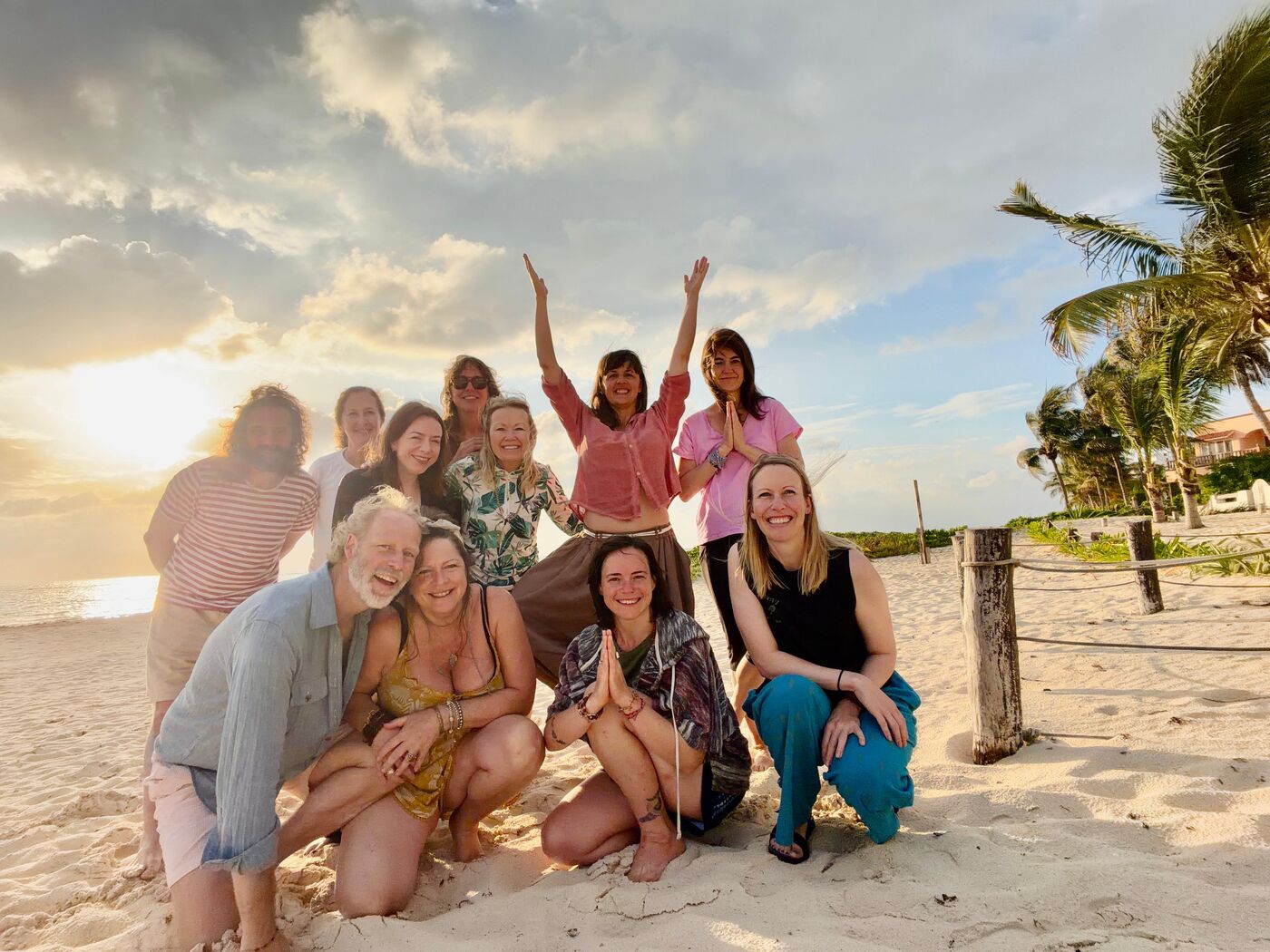 300-hour YTT students at sunset on the beach in Mexico