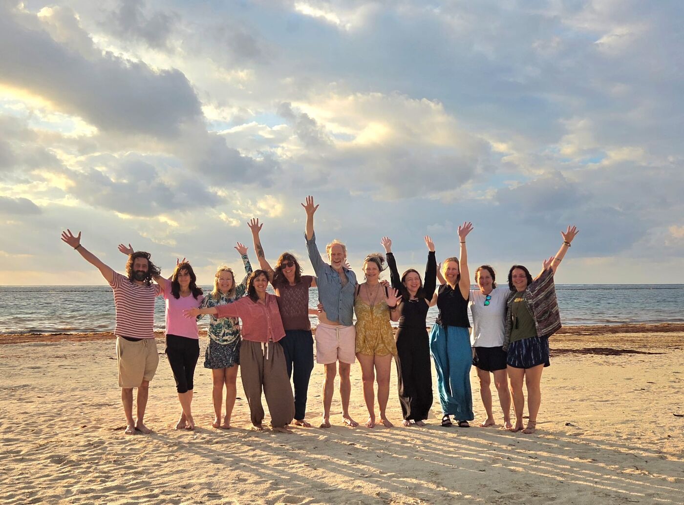 300-hour yoga teacher training group on the beach in Mexico