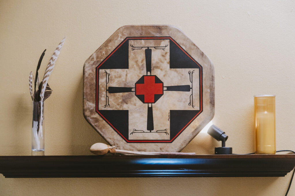 Ceremonial frame drum and feathers at Karma Yoga Center