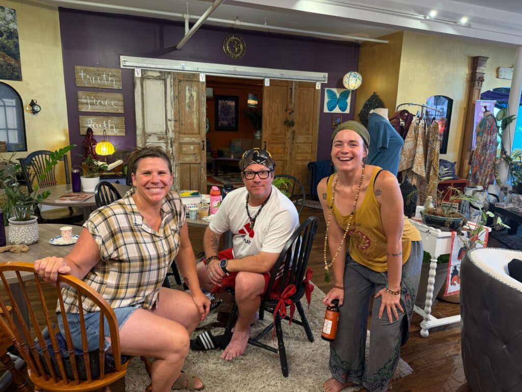 Friends gathering in the community lounge at Karma Yoga Center