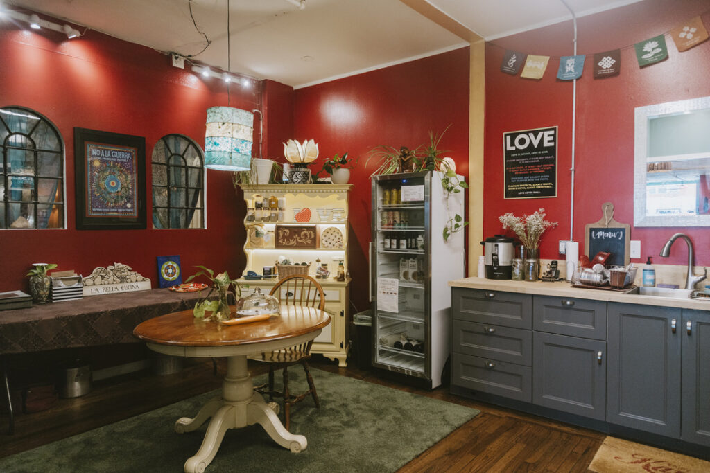 Community kitchen with red walls at Karma Yoga Center, Denver