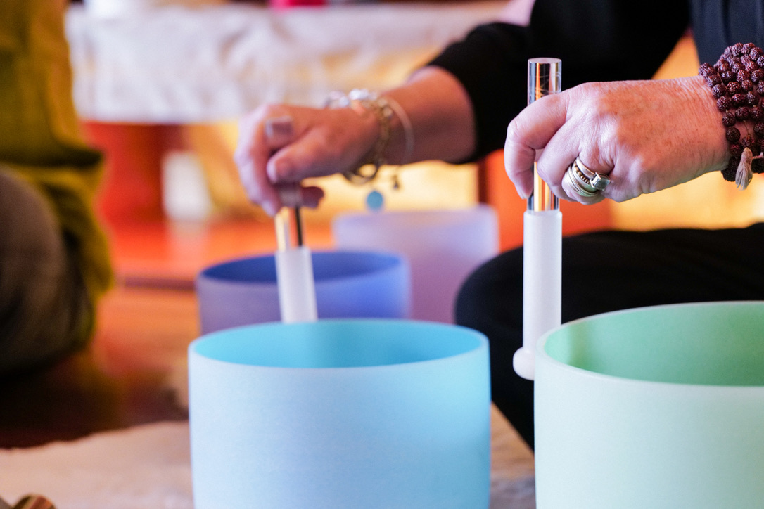 Crystal singing bowls being played at Karma Yoga Center