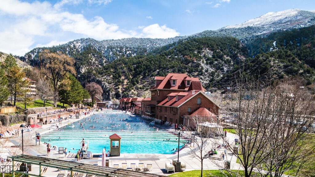 Glenwood Hot Springs Pool in winter beneath snowy mountains
