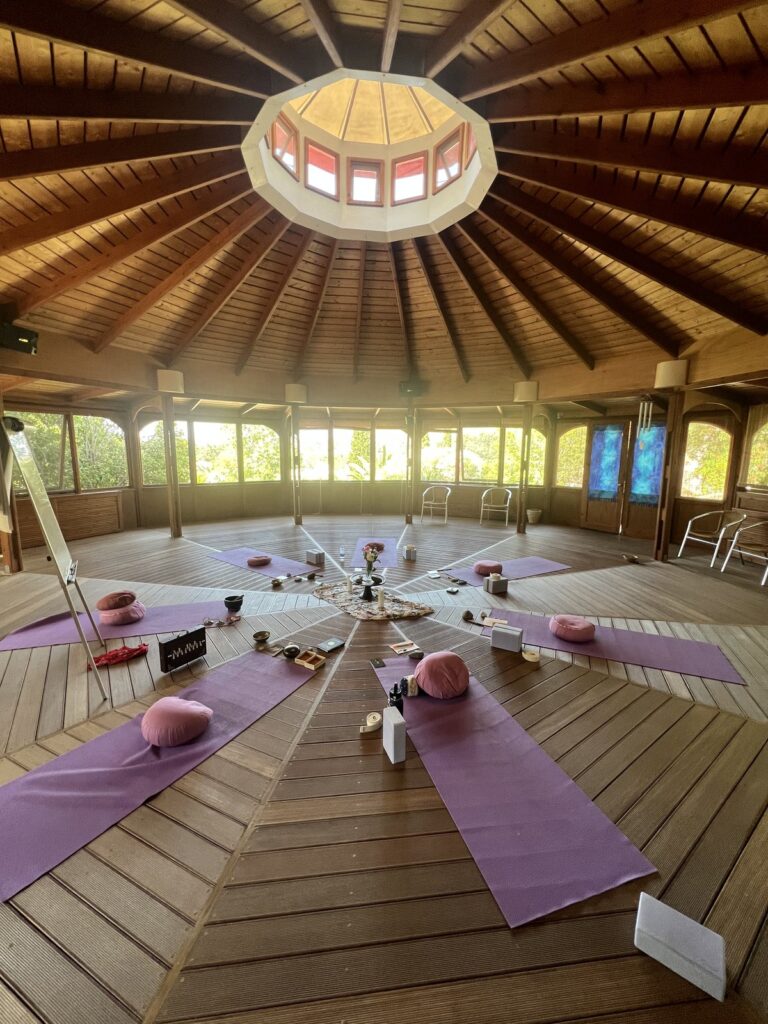 Round wooden yoga shala set with mats for the Greece retreat