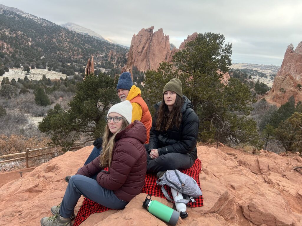 Retreat friends on red rocks near the Garden of the Gods