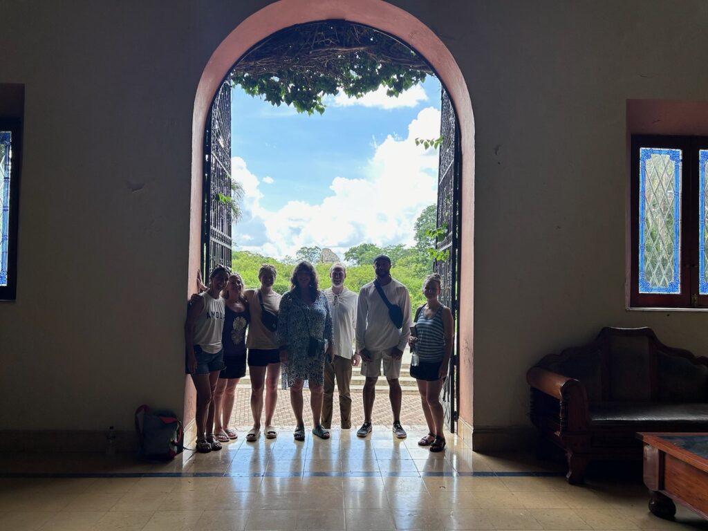 Retreat group framed in a colonial doorway in Mexico