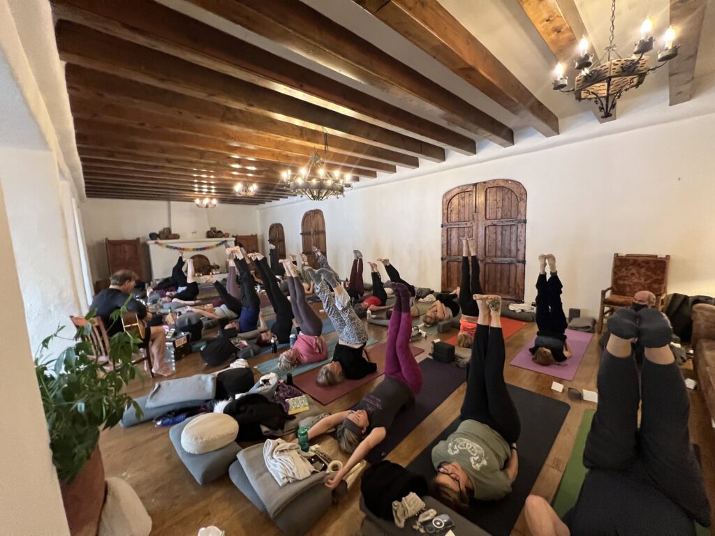 Yoga practice in an adobe hall at the New Mexico retreat
