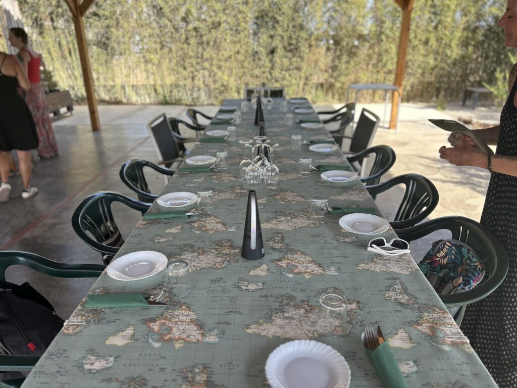 Long shared table set for a paella dinner on the Spain retreat