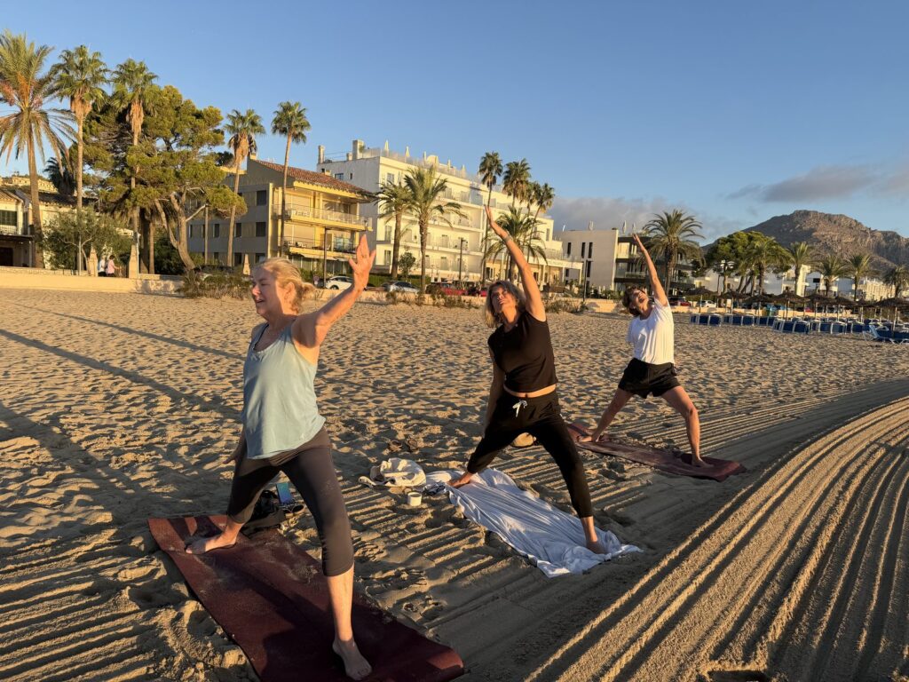 Sunrise yoga on the beach in Mallorca