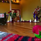 Karma Yoga Center studio with flowers and a Choose Love sign Karma Yoga Center studio with flowers and a Choose Love sign