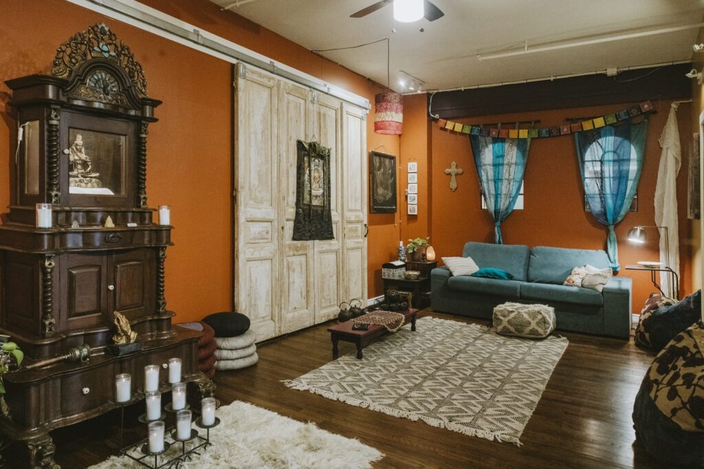 Meditation room with altar and candles at Karma Yoga Center