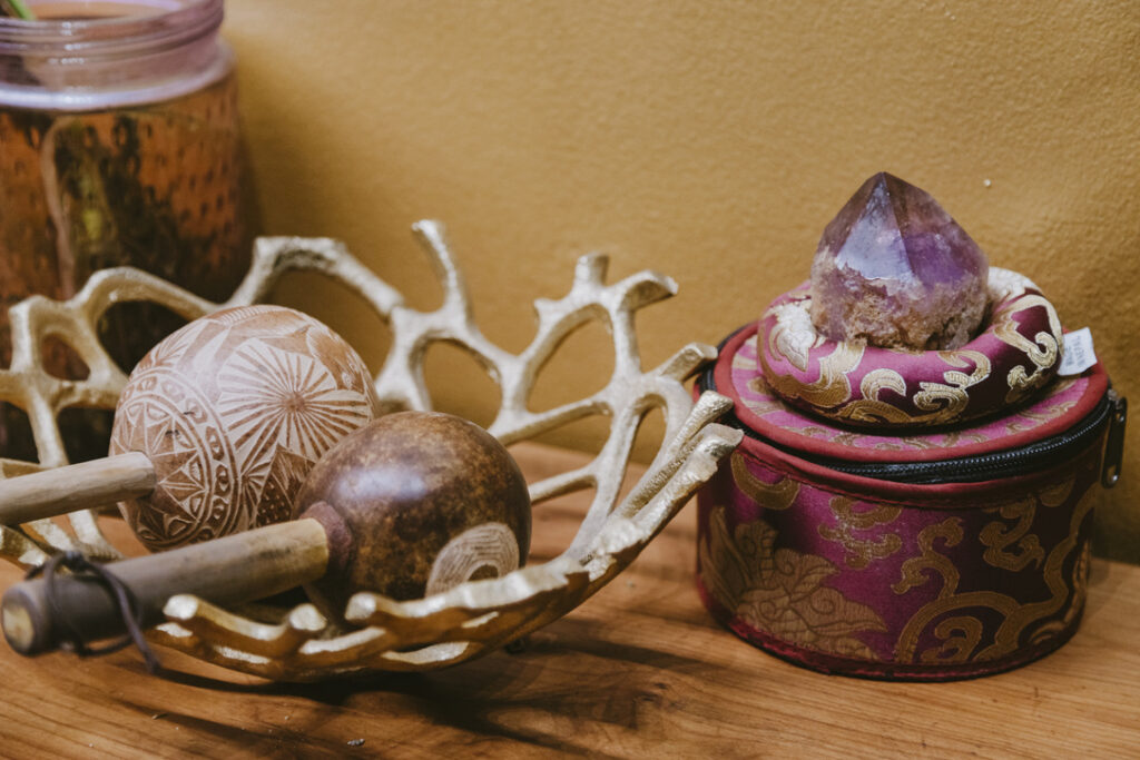 Carved gourd rattles and an amethyst point at Karma Yoga Center