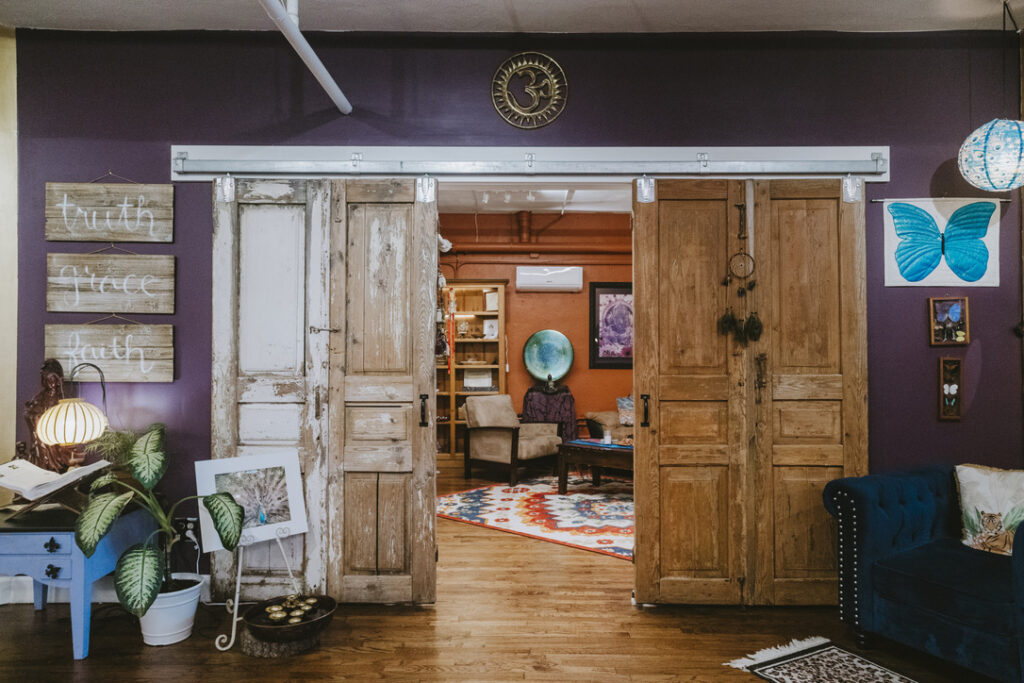Barn-door entrance to The Shaman & The Mermaid room at Karma Yoga Center