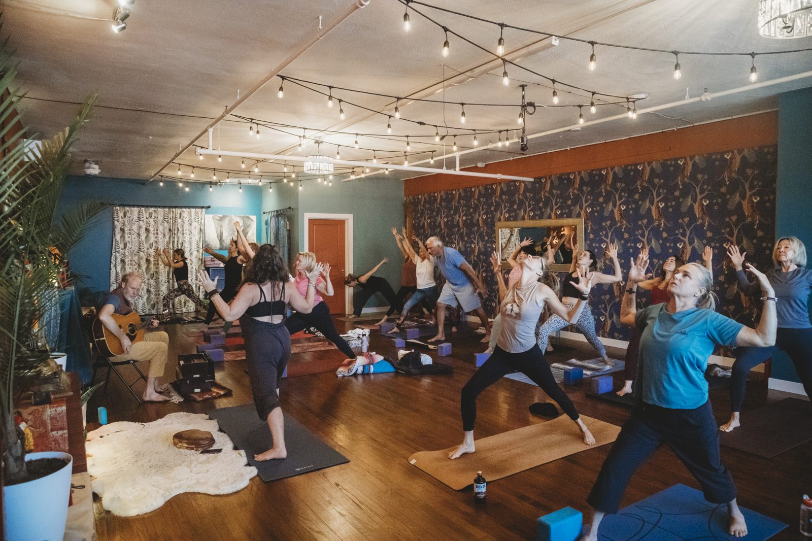 Students in a yoga class at Karma Yoga Center, 1760 S. Broadway, Denver